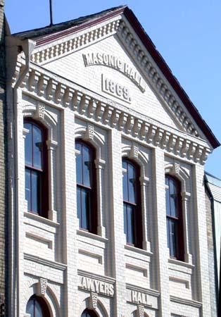 Third storey featuring segmentally arched windows and date stone, 2004.; City of Brantford, Department of Planning, 2004.
