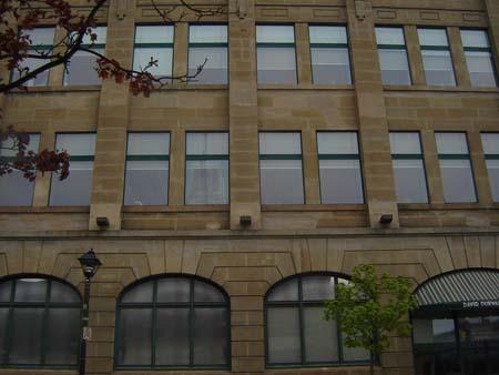 Of note is the classical symmetry and arched first-storey windows.; Kendra Green, 2007.