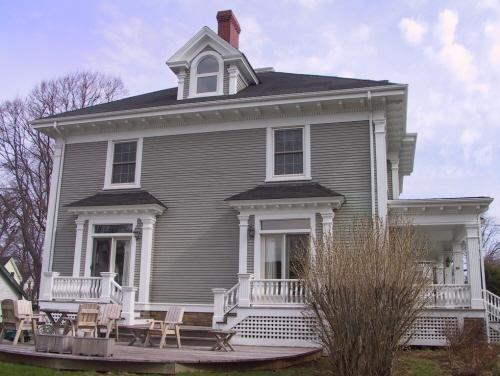Showing south elevation with patio; Wyatt Heritage Properties, 2003