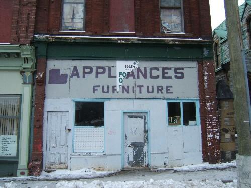 This photograph shows the storefront and the pilasters, 2004; City of Saint John