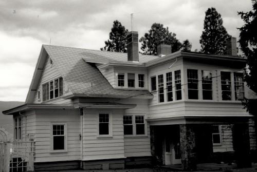 Façade of the Former Superintendent's Residence, showing the two-storey asymmetrically massed structure, with a gabled roof, 1989.; Parks Canada Agency / Agence Parcs Canada, 1989.