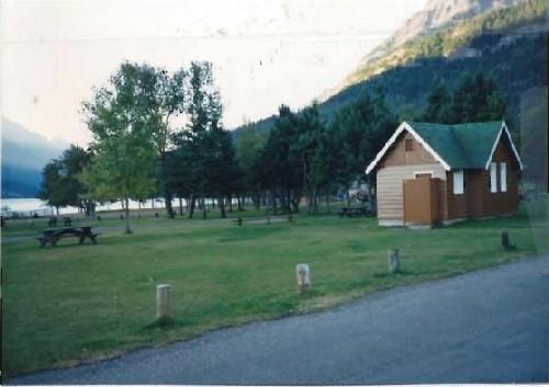 General view of Comfort Station 8, showing the simple, cruciform, low massing of the one-storey structure, 1990.; Parks Canada Agency / Agence Parcs Canada, 1990.