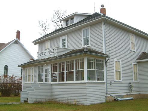 View of verandah and front façade of the St. Brieux Museum.; Winkel, 2007