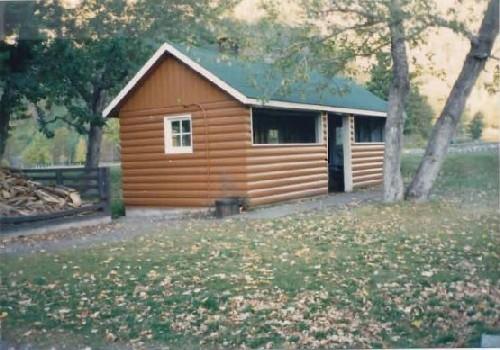 General view of Kitchen Shelter 9, showing the four-foot high walls, 1990.; Parks Canada Agency / Agence Parcs Canada, 1990.