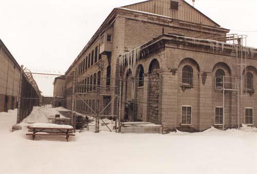 View of the East Workshop, showing the three storey massing with a medium-pitched gable roof, 1989.; Travaux publics Canada / Public Works Canada, 1989.