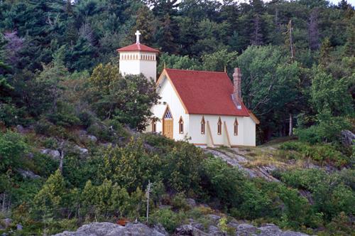 General view of Building 42 showing the masonry chimney with an elaborated cap, and the attached bell tower with a gently pitched pavilion roof, circa 2004.; Parks Canada Agency | Agence Parcs Canada, c. | vers 2004