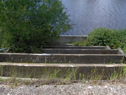 Close-up view of the cement blocks that served as the base of the Fraser Mill's sluice, the only vestiges that remain today.; Madawaska Historical Society
