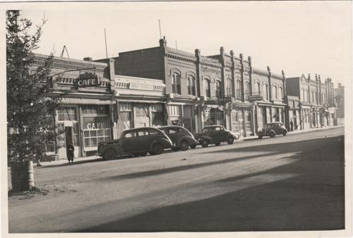 Archival view showing the Former Rex Cafe Site (far left), the building that once occupied the present 125th Commemorative Park, Carberry, 1944.; Carberry Plains Archives, 1944