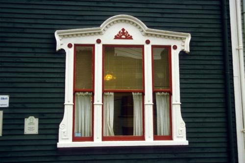 Detail of Palladian-style front window with ornate elements.  Photo date unknown.; HFNL 2007