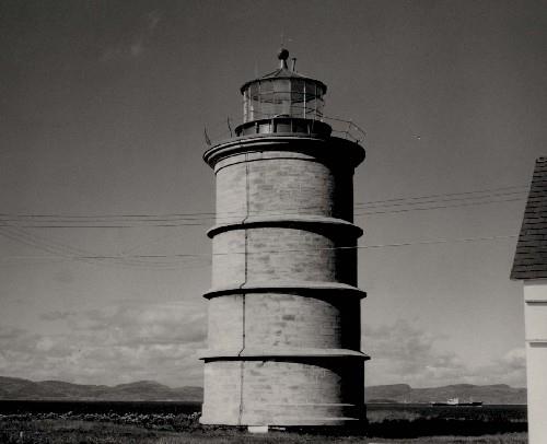 General view of the Lighthouse, showing the stone masonry construction of smooth, dressed ashlar stone, circa 1975.; Transport Canada / Transports Canada, circa/vers 1975.