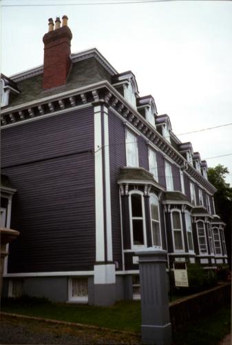 View of main facade showing eaves brackets, bay windows and dormer windows. Photo taken 1990s.; HFNL 2007