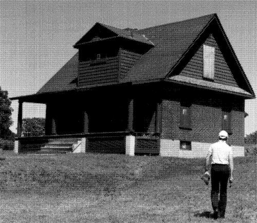 Corner view of Sydney Lockmaster's house at Trent Lock Number Two showing its brick ground storey, clapboard gables, and shingled roof.; Ontario Regional Office, Canadian Parks Service, n.d.