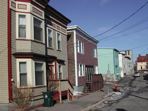 This photograph shows the streetscape and illustrates the common characteristic of the simple projecting cornices, 2005; City of Saint John