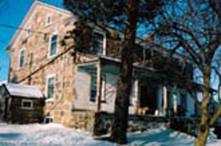Of note is the stone construction and stucco verandah.; Township of Wilmot, 2007