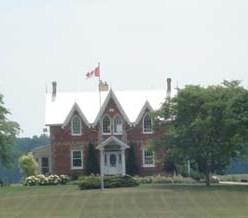 Of note are the bargeboard and finials on the three front gables.; Kendra Green, 2007.