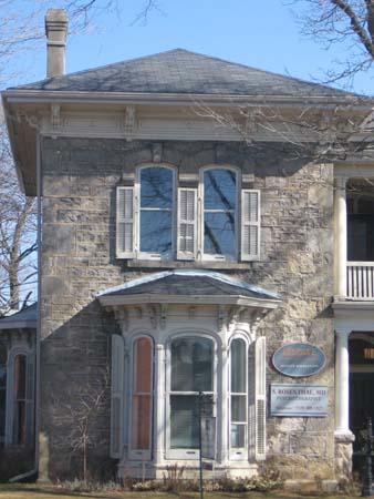 Featured are the bay windows, shutters, eave brackets and carvings.; Lindsay Benjamin, 2007.