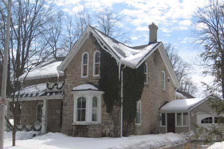 View of the east façade depicting the triple bay window with brackets, 2007.; Lindsay Benjamin, 2007.