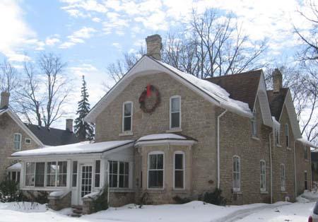 View of the three-sided bay window in the front (east) wall built of limestone, 2007.; Lindsay Benjamin, 2007.