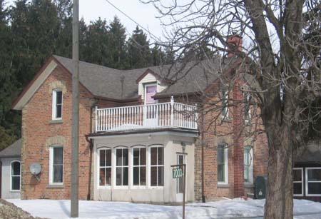 View of the south and west elevations of 7003 Highway 6, 2007.; Kayla Jonas, 2007.