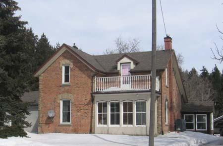 West façade of 7003 Highway 6, 2007.; Kayla Jonas, 2007.