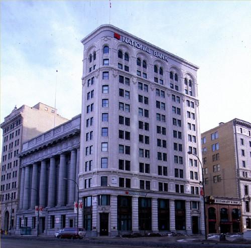 View of the Union Trust Tower, showing its trapezoidal, thirteen-storey massing under a flat roof, an Italianate decorative scheme and tripartite vertical division.; Agence Parcs Canada / Parks Canada Agency