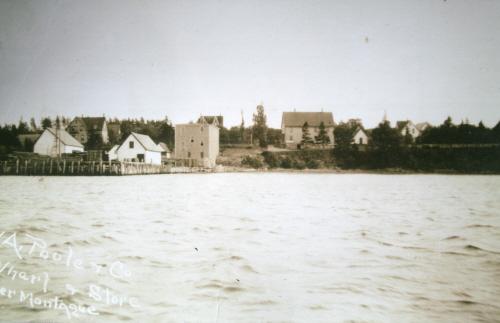 Poole House on left above wharves and stores; Donna Collings Collection