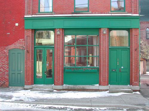 This photograph shows the storefront  and two entrances of the building, 2005; City of Saint John