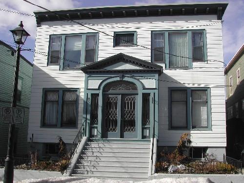 This photograph shows the front façade of the building, 2005; City of Saint John