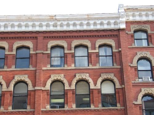 This photograph shows the pointed arch, segmented arch and Roman arch windows, as well as the decorative cornice, 2004; City of Saint John