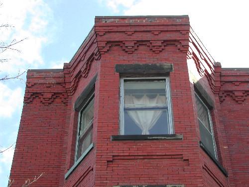 This photograph shows the roof-line cornice and the top of the bay window, 2005 ; City of Saint John