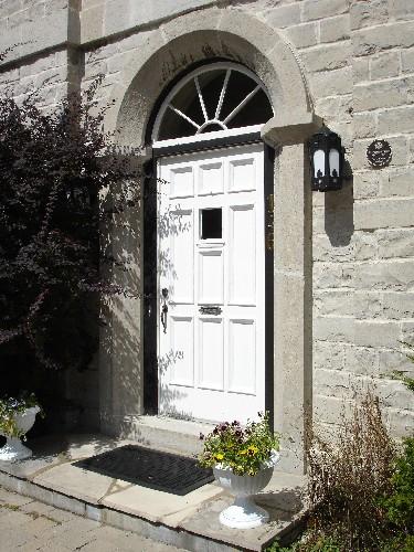 Detail view of semi-circular arched main entranceway; RHI 2006