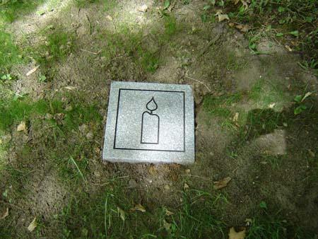 Featured is one of the stone markers marking the burial place of over 140 black settlers.; Kendra Green, 2007.