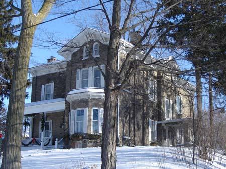 The detailed brackets under the eaves are visible, as well as the two bay windows, 2007.; Lindsay Benjamin, 2007.