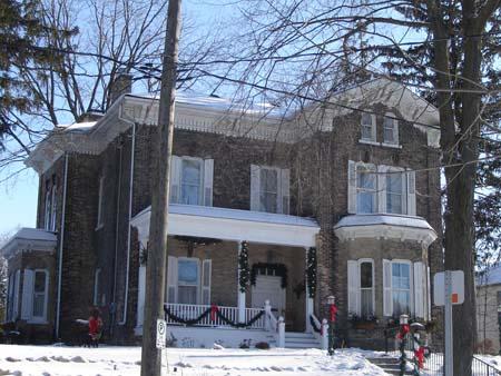 The outstanding wooden frieze is clearly visible under the eaves of the house in this image, 2007.; Lindsay Benjamin, 2007.