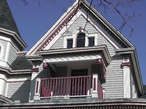 This photograph shows the two-storey bay with pediment supported by ionic pillars with paladian window inset in upper storey, 2005; City of Saint John
