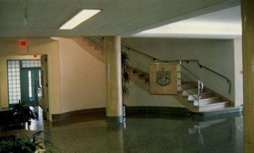Interior view of Building M-20, showing the interior spatial arrangement of the main lobby, 1990.; National Research Council of Canada / Conseil national de recherches du Canada, 1990.