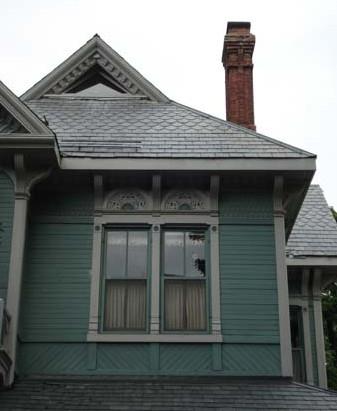 Of note is the horizontal and diagonal wood siding and the slate roof.; Martina Braunstein, 2007.