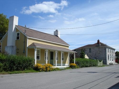 Typical Barriefield: low scale wood frame and limestone houses, built close to the street; RHI 2006