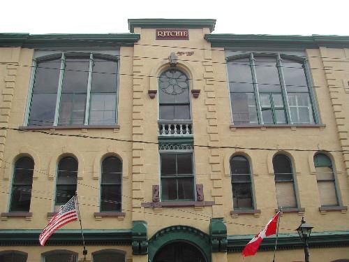 This photograph shows the unique characteristics of the building such as the Roman arch windows and large segmented arch windows, 2005; City of Saint John