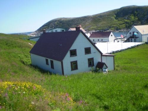 View of rear facade and overlooking Battle Harbour. Photo taken 2008.; HFNL 2008