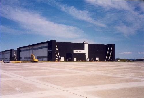 View of Hangar 7, showing the large open expanses of the paved aprons and taxiways, 1992.; Department of National Defence / Ministère de la Défense nationale, 1992.