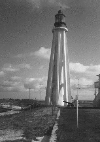 General view of the Light Tower, showing the eight concrete flying buttresses with their webbed design supporting the structure at each of its three principal floor levels, 1990.; Parks Canada Agency / Agence Parcs Canada, 1990.