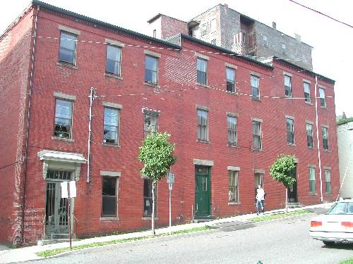 This photograph shows the contextual view of the 3 unit complex, 2005; City of Saint John