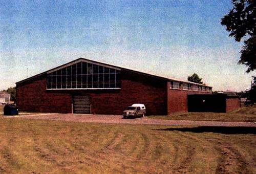 Rear view of the Drill Hall, showing the durable exterior materials including concrete, brick, steel and glass; Department of National Defence / Ministère de la Défense nationale, 2001