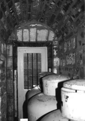 View of a storage room of Building 30, showing its vaulted interior, 1991.; Parks Canada Agency / Agence Parcs Canada, Rhona Goodspeed, 1991.