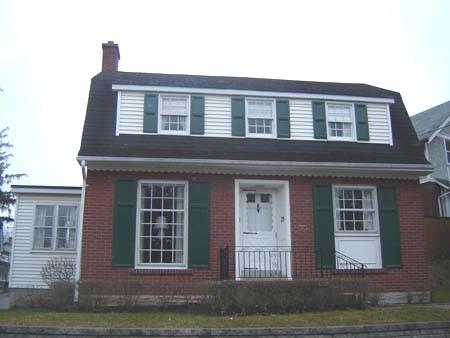 Featured is the symmetrical elevation with large front windows, 2007.; Lindsay Benjamin, 2007