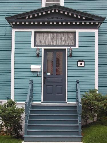 This photograph shows the entrance, transom window and pediment decorated with dentils, 2005; City of Saint John