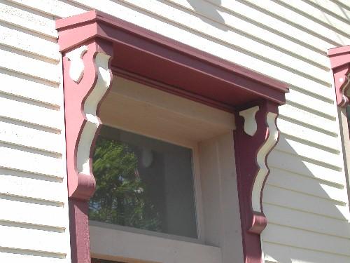 This photograph shows the entablature over the entrance, 2005; City of Saint John