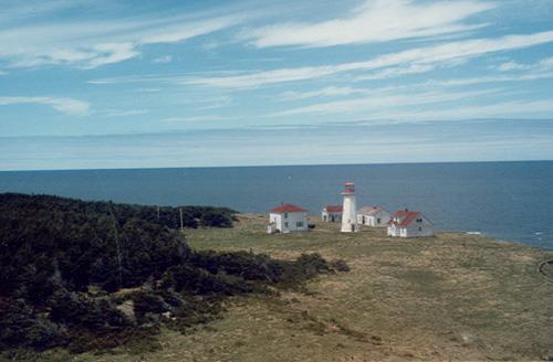 General view of the Light Tower, showing the simple massing, which consists of a white concrete, octagonal tapered tower.; Transport Canada / Transports Canada.