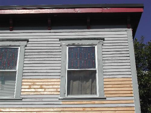 This photograph shows the roof-line cornice, 2005; City of Saint John